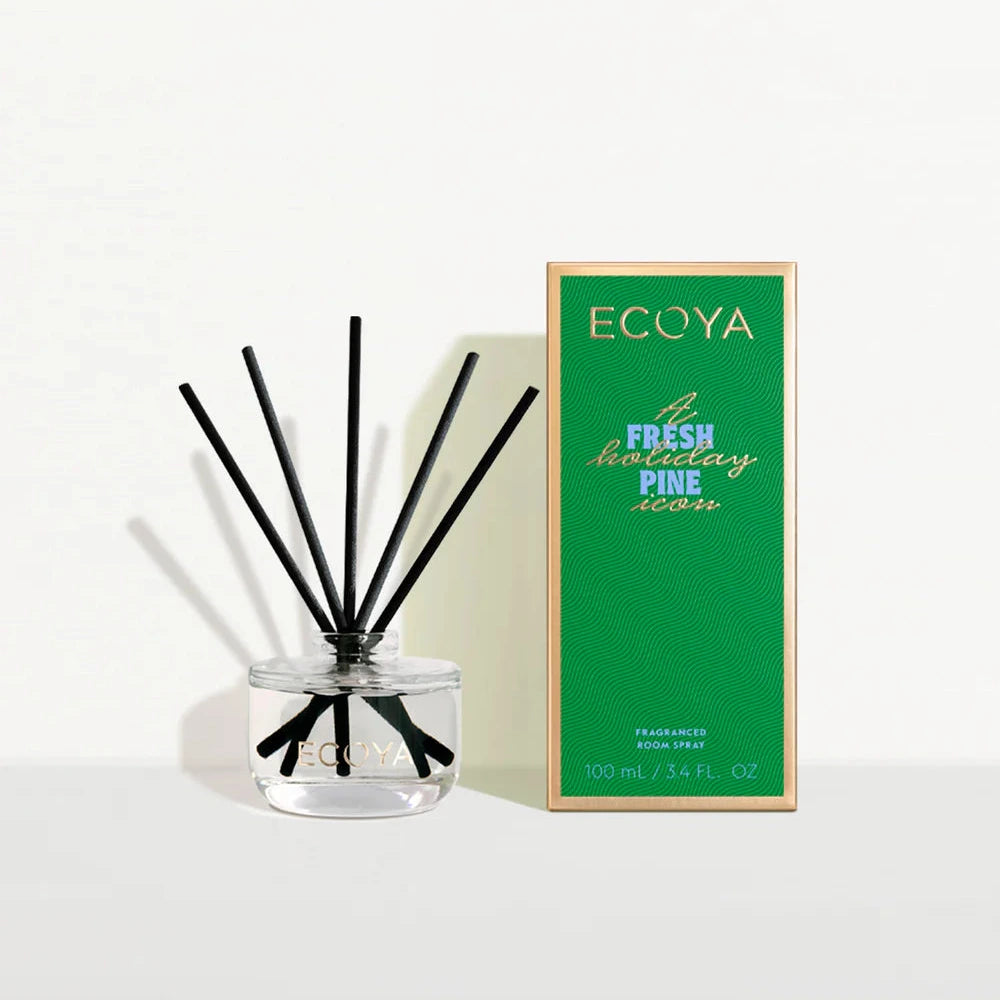 ECOYA diffuser with black sticks and green packaging on a white background