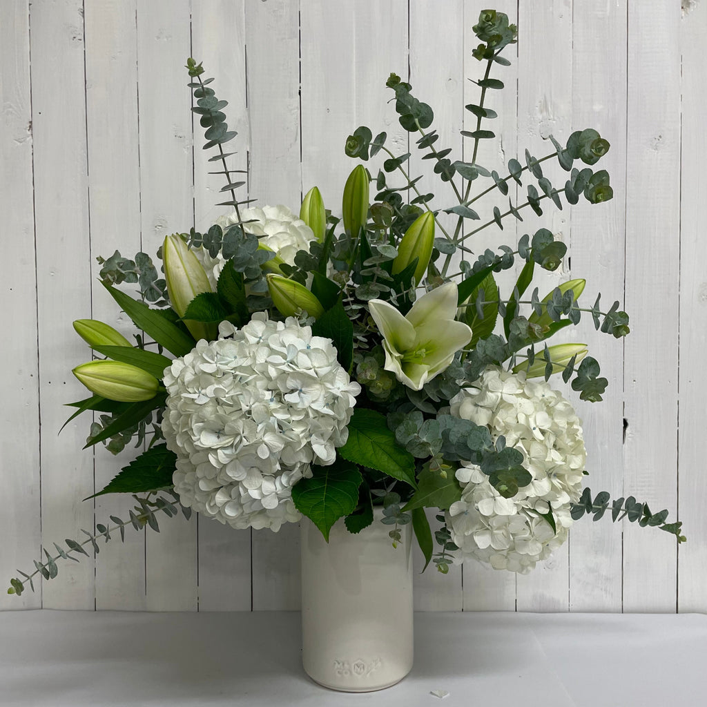 White flower bouquet in vase  sympathy flowers Moffatt's Flower Company Christchurch